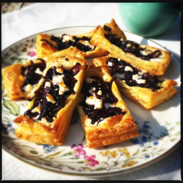 Little pastry with caramelized red onions & goat cheese